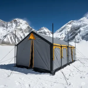 A robust base camp tent standing firm in a snowy, high-altitude environment, illustrating its suitability for harsh conditions.