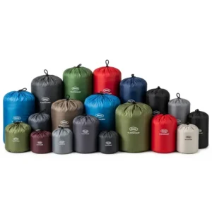 An array of sleeping bag storage sacks in various sizes, showcasing options for different sleeping bag types and volumes.