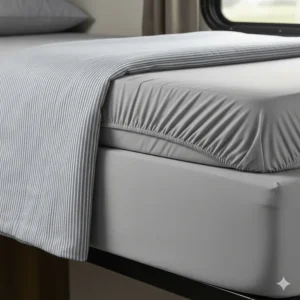 Fitted and flat sheets specifically designed to fit the narrow and unique dimensions of a camper bunk mattress.