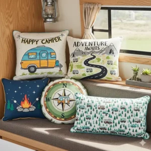 A collection of colorful, decorative pillows with RV-themed designs, adding a personalized touch to a camper's decor.