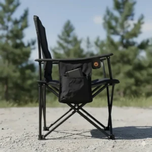Side view of a portable, black heated camp chair clearly showing the battery pocket and power button.