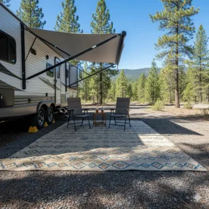 An image of an RV awning mat stretched out under a camper's awning on a sunny day to emphasize its UV-resistant properties.