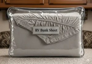 A zippered bag holding a folded RV bunk fitted sheet, illustrating the convenient storage solution for keeping linens organized.