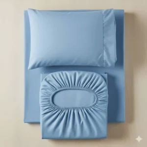 An overhead view of a complete RV bunk sheet set, including a fitted sheet, a flat sheet, and a pillowcase, neatly folded and ready for use.