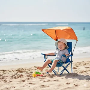An image showing a toddler enjoying the beach while sitting comfortably in the portable toddler camping chair.