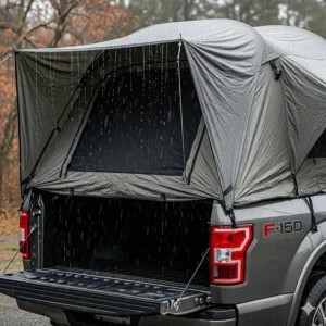 A durable F-150 tent with rain beading on its waterproof material, demonstrating its weather resistance.