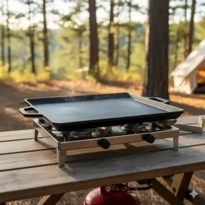 A heavy-duty cast iron camp griddle for even heat distribution on any portable stove.