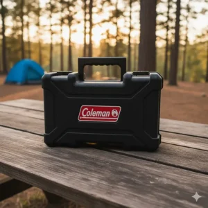 The compact, folded Coleman camping stove with griddle stored inside its rugged portable carrying case.