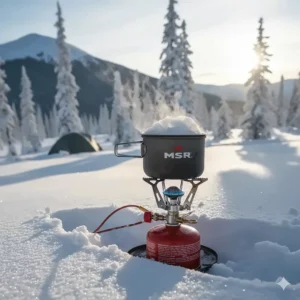White gas stove reliably boiling snow for water in cold, winter camping conditions.