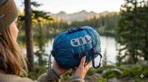 Folding an ENO hammock into its integrated compression stuff sack.