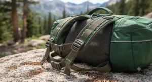 Close-up of adjustable straps and breathable mesh on a dog backpack for hiking.