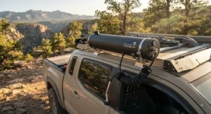 A high-capacity solar shower mounted to the roof rack of an overland vehicle.