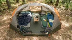 Demonstration of tent size capacity with a rectangular sleeping bag for family camping laid inside