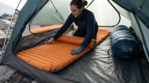 Using an insulated sleeping pad with a high R-value beneath the warmest winter sleeping bag for car camping